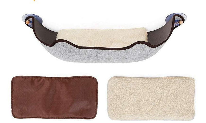 PetHaven.comWindow sill cat hammockWindow sill cat hammockSize: 59*22*13cm
 
 Material: EVA + felt cloth
 
 Product Features / Features:
 
 
 A wrapped suction cup cat hammock for winter and summer
 
 
 1. The cat litter isDog/Cat house