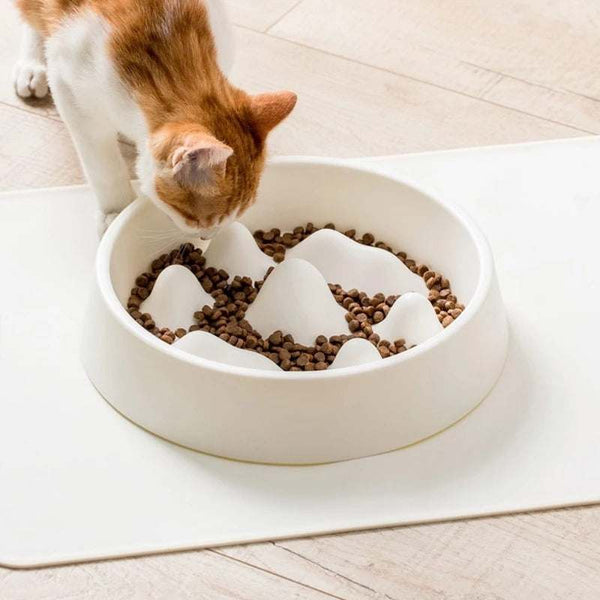 PetHaven.comPet Slow Food BowlPet Slow Food BowlMaterial: PP
 
 Color: off-white, blue
 
 Various shapes of mountains in the food plate, scientific separation design
 
 Unable to contact food in a large area at on0